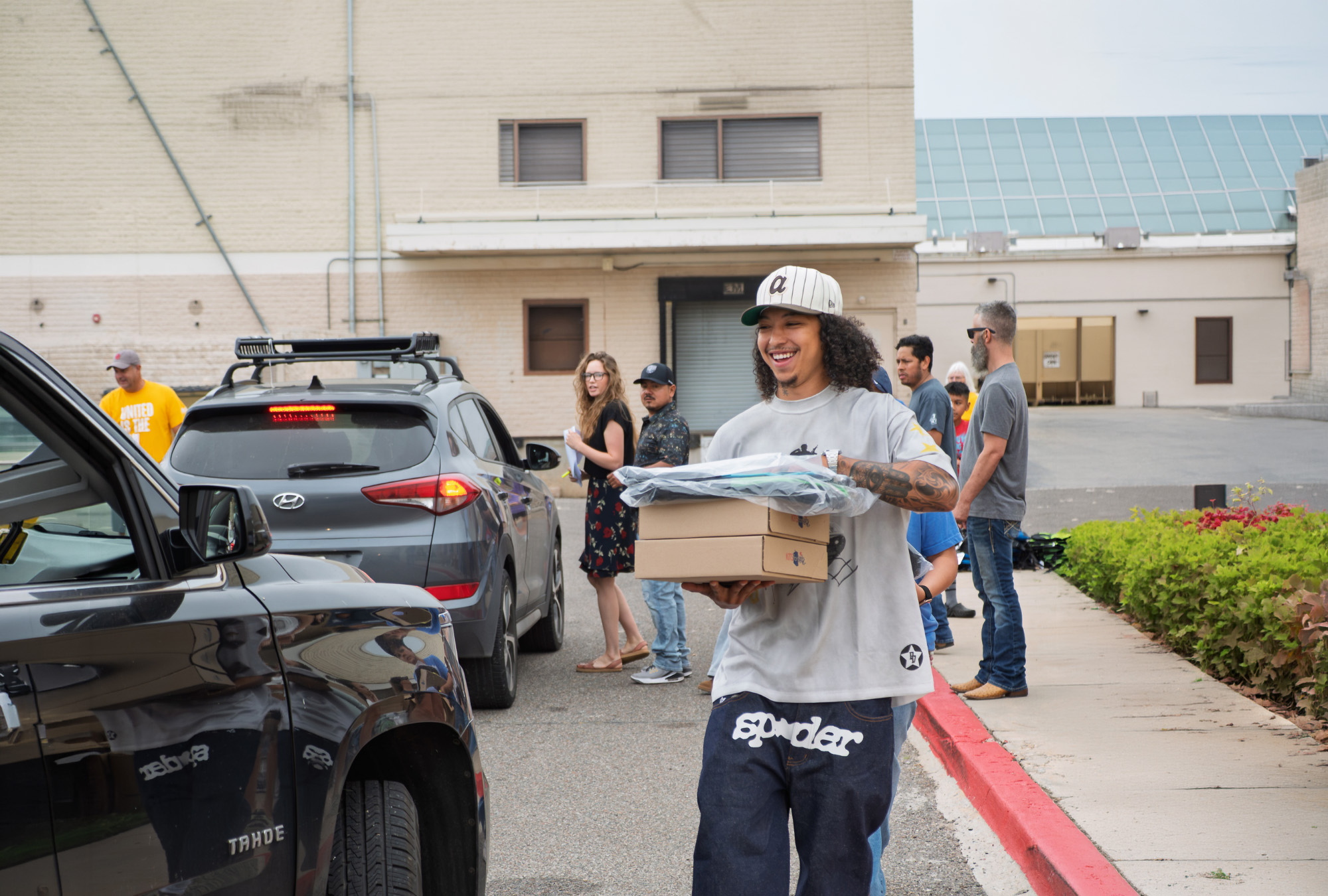 Volunteers distribute school supplies