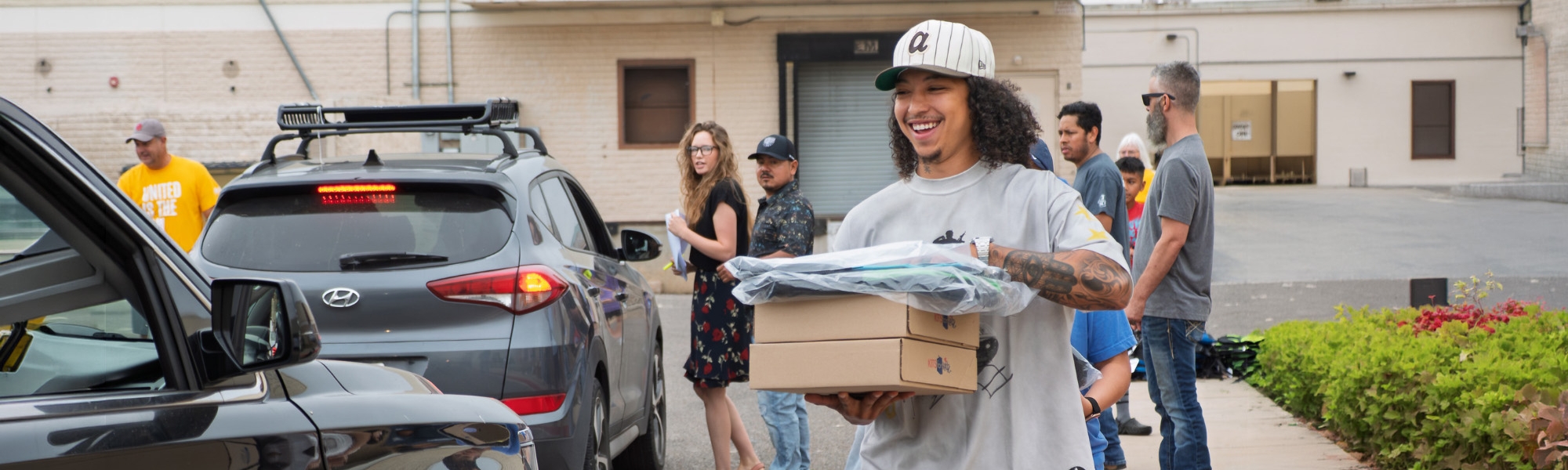 Volunteers distribute school supplies
