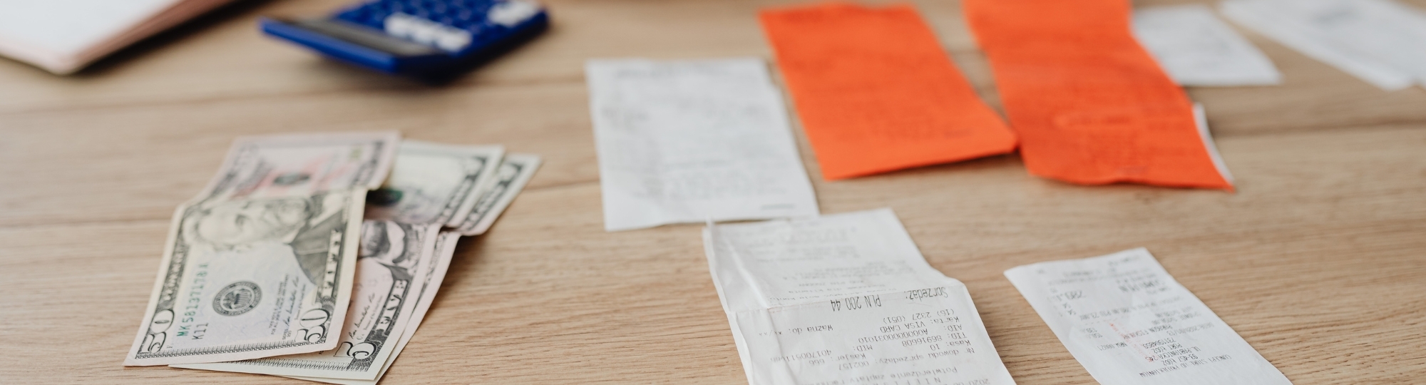 Table filled with receipts and cash